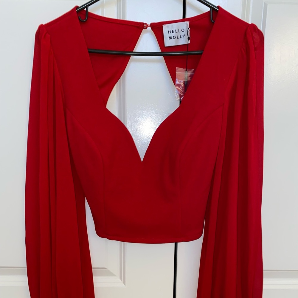 Red flowy top with open back